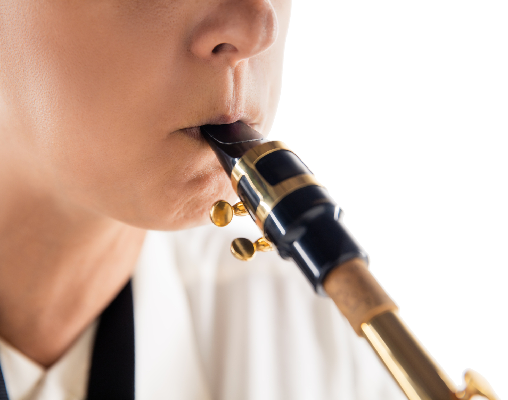 Close up woman playing saxophone isolated on white studio background. Inspired musician, details of art occupation, world classic instrument for jazz and blues. Concept of hobby, creativity.